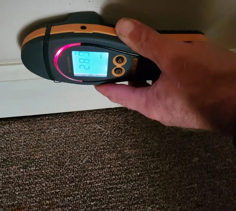 Moisture detection at baseboard during Storm Damage Restoration in Gloucester City